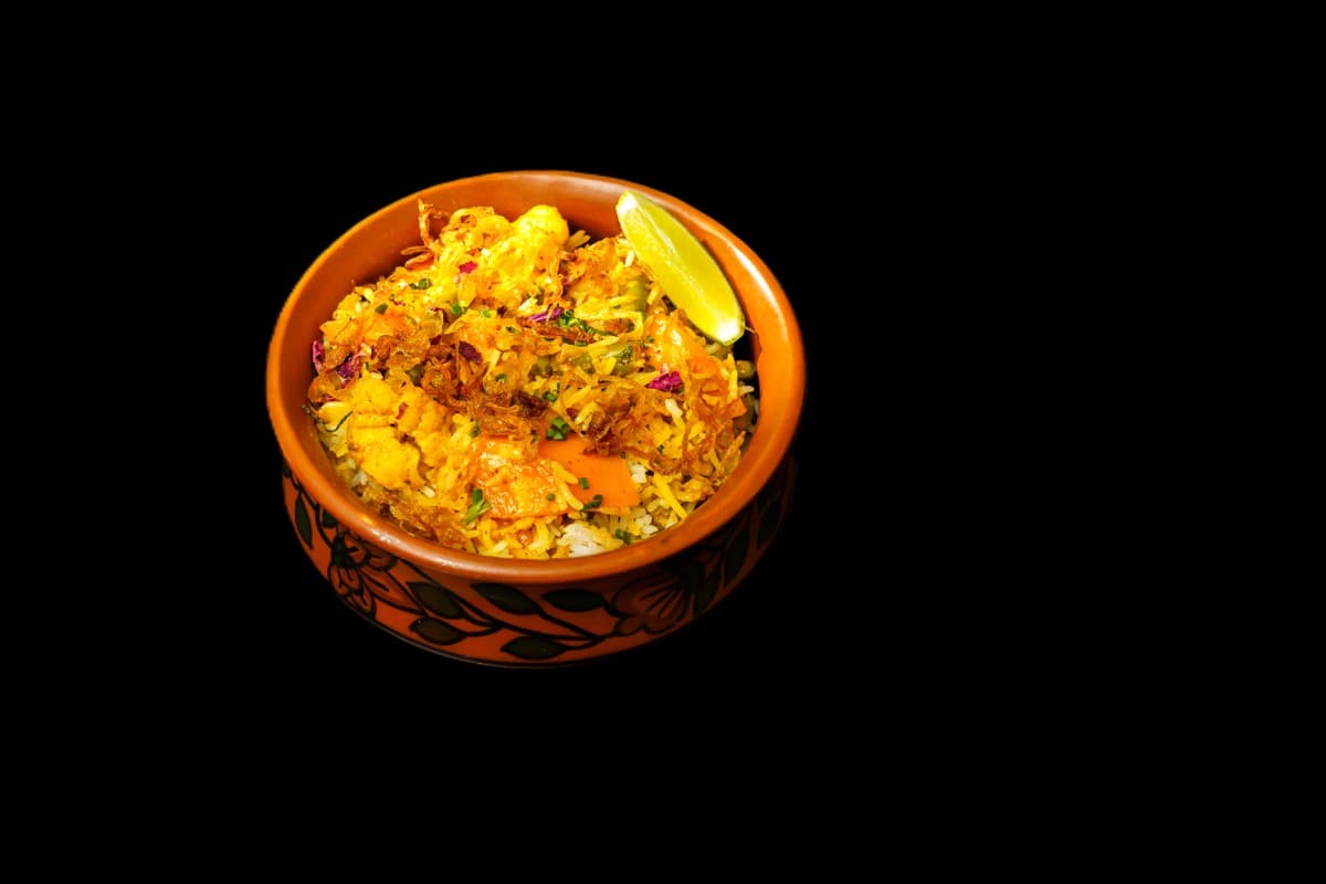 Chicken Biryani — Aromatic and popular, think of it as a paella. You can have the Biryani with any type of combination that s