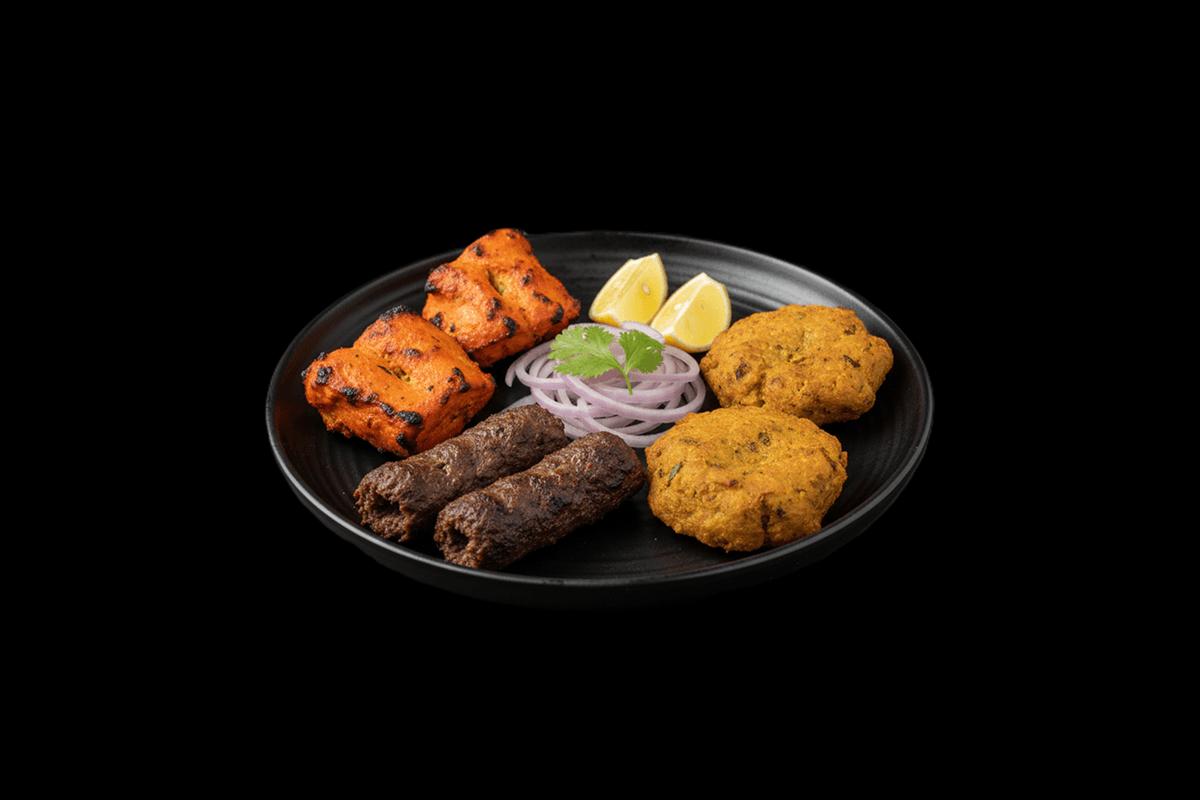 Meat Mixed Grill — Sheek Kebabs, Lamb Tikka pieces, Lamb Chops, marinated in eastern spices & herbs, barbecued on skewers and