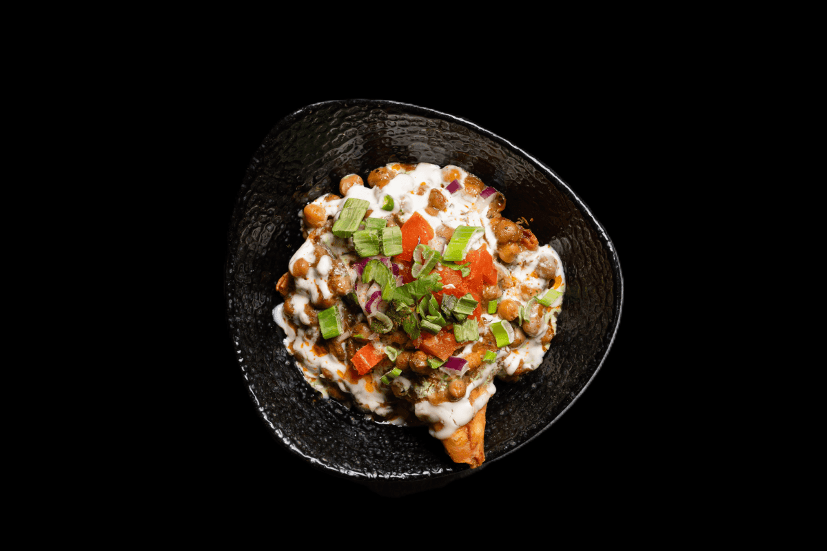 Samosa Chaat — Crushed vegetable samosa topped with chickpeas, sweet yogurt, mint, and tamarind chutney, GB Canteen Basingsto