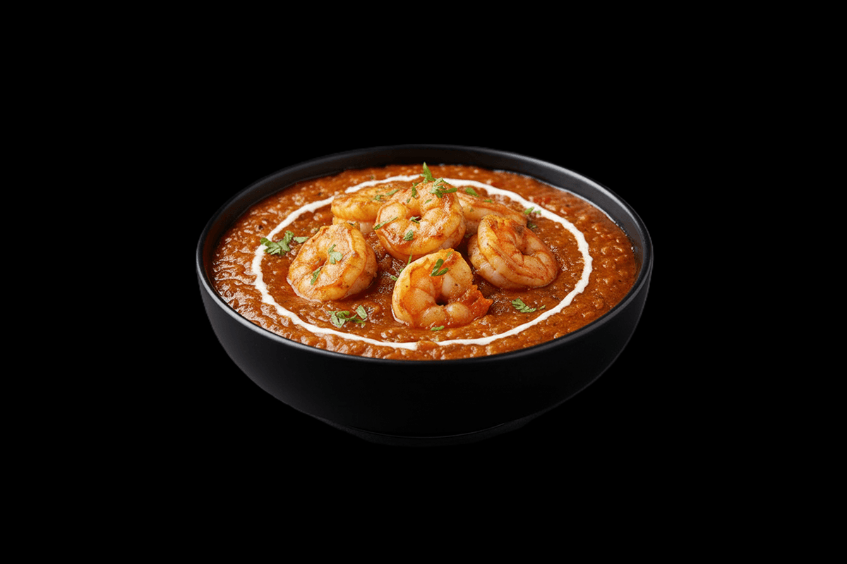 Dhansak - King Prawn — Cooked with dall, fenugreek leaves and lemon to make a savoury, sweet & sour, hottish dish. Served wit