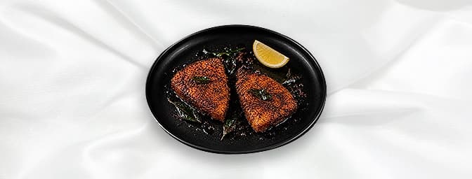 Masala Fried Fish — Tillapia fillets native to Kenyas Lake Victoria marinated in chilli, lemon and spices and batter fried to