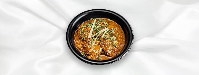 Lamb Pathia — Sweet, sour and hot sauce cooked with tamarind and spices, GB Canteen East Molesey