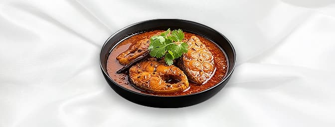 Fish Curry — Boneless king fish dipped in mouth watering coconut flavoured sauce the best kept Kayal's spicy secret sauce, GB