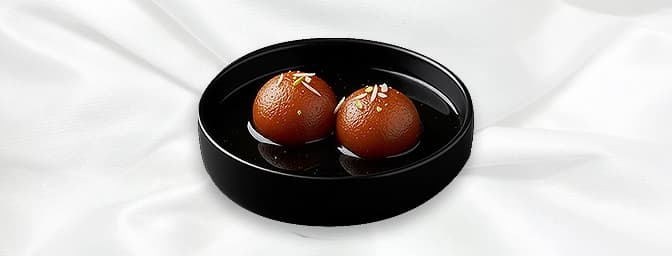 Gulab Jamun — Milk- Solid dumplings preserved in sugar syrup served with ice-cream, GB Canteen Leamington Spa