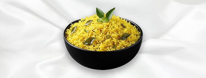 Naranga Choru — Tangy, fresh tasting rice tossed with lemon juice, fresh curry leaves, mustard seeds and dried red chillies, 