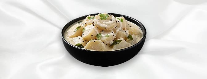 Pal Kappa — Tapioca is boiled mashed and combined with milk, green chilies, and a dash of cumin, creating a creamy, dish that