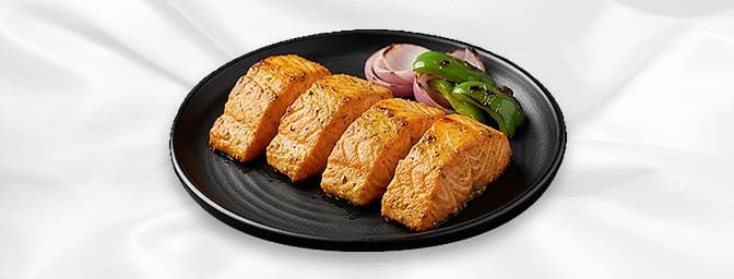 Tandoori Salmon — Carom seeds, dill, spices and lime marinated fillets of salmon grilled and cooked to perfection in the tand