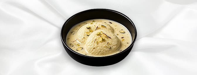 Rasmalai — Rich, sweet milk sponge in creamy milk syrup, dressed with pistachio, and almonds, GB Canteen Greenford Indian