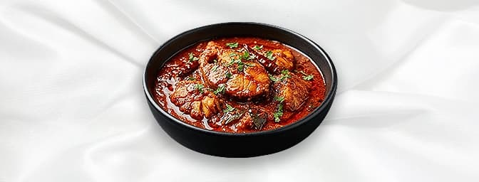 Masala Macchi — Fillet of tilapia braised in madhus unique masala flavoured with roasted carom seeds, GB Canteen Greenford In