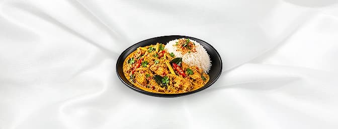 Malaysian Chicken Curry — Slices chicken in yellow curry with chili, turmeric, lemongrass, galangal, shrimp paste, ground spi