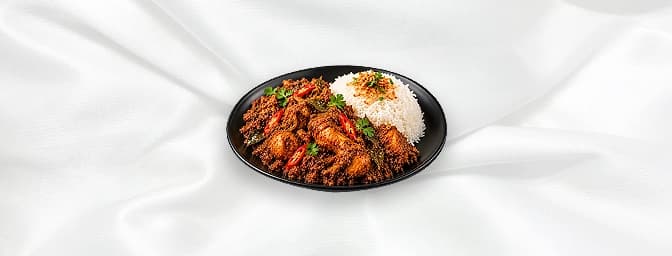 Rendang Chicken — Slow cooked chicken with aromatic spices such as roasted coconut, bay leaves, galangal, chili, onions, ging