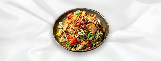 Fattoush — Salad of mixed greens, cherry tomatoes and radishes tossed with apple vinegar & spiced crispy Lebanese bread, GB C