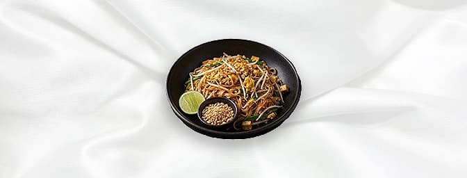 Pad Thai Noodles — A very traditional Thai stir-fried noodles with bean sprouts & egg � served on the side with a bowl of cru