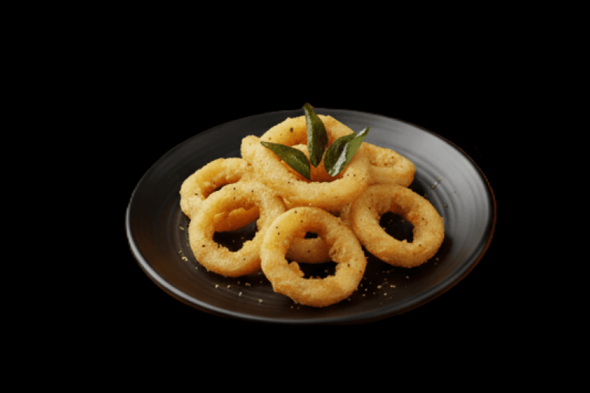 Squid Jhol — Chopped squid cooked with red wine in a slightly spicy tangy tomato sauce, served in a puri with salad. Seafood 