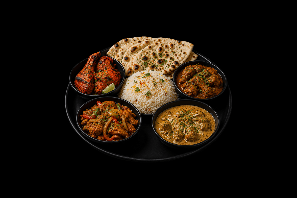 Non Vegetable Thali — Tandoori Chicken, Chicken Bhuna, Chicken Jalfrezi and Lamb Pasanda, served with pilau rice and naan, GB