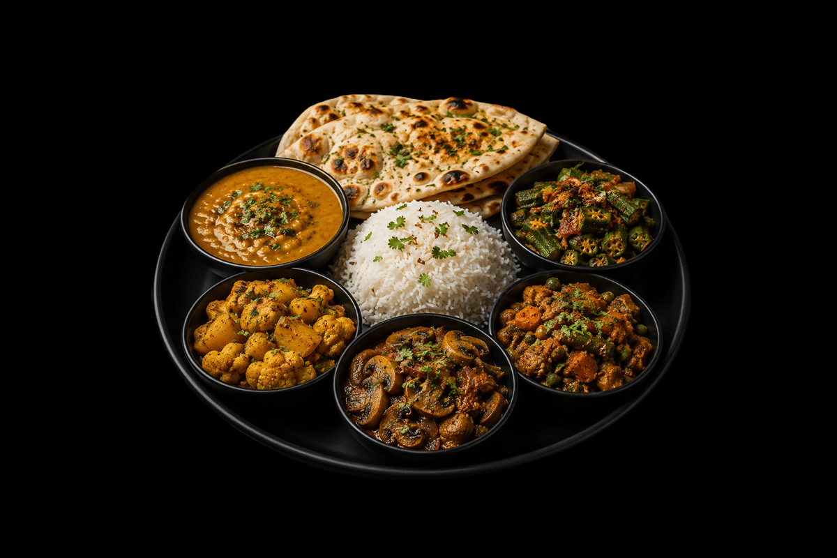 Vegetarian Thali — Dal Massala, Bhindi Bhaji, Aloo Ghobi, Mushroom Dupiaza and Vegetable Bhuna, served with rice and naan, GB