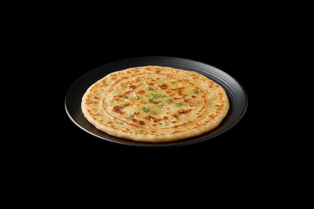 Paratha — Wholemeal bread fried in butter, GB Canteen Kensal Rise