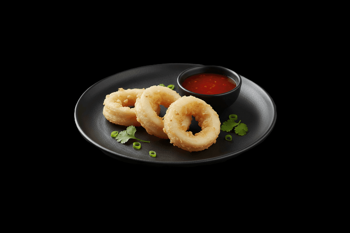 Calcutta Calamari — Bengali version of the Spanish favourite. Spiced gramflour battered squid rings, deep fried. Served with 