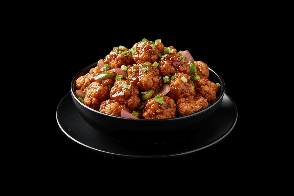 Cauliflower Manchurian — Cauliflower mixed with corn flour batter, pan fried, tossed with onion & capsicum, GB Canteen Tootin