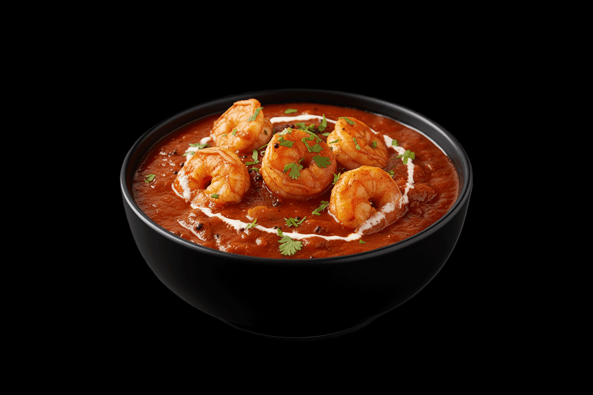 Moolee - King Prawn — From south India. In a delicate coconut sauce made golden with turmeric and lightly spiced with mustard