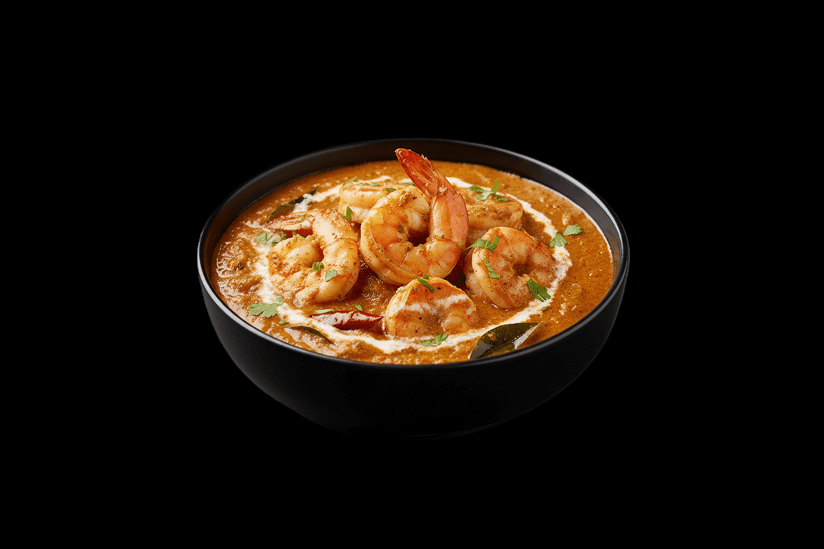 Moolee - Prawn — From south India. In a delicate coconut sauce made golden with turmeric and lightly spiced with mustard seed