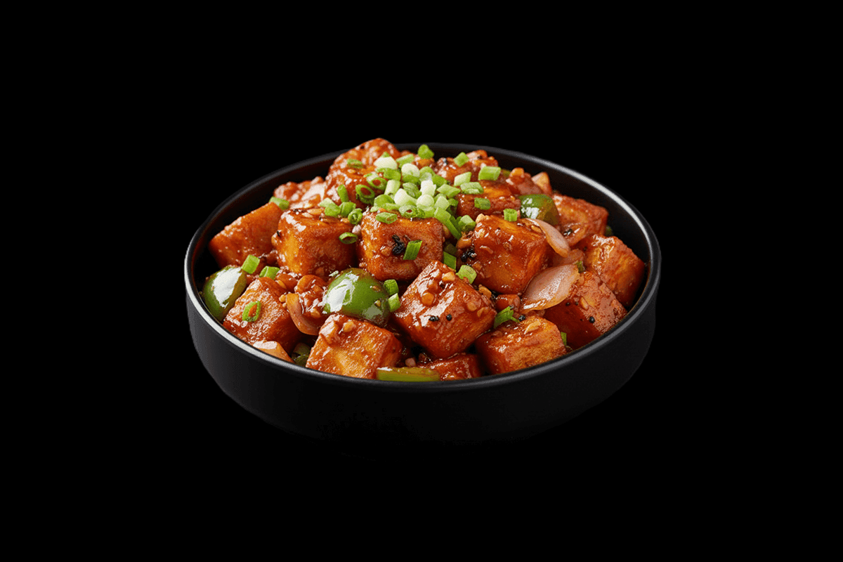 Paneer Manchurian — A dish made with crispy deep-fried paneer, chilli flakes, vinegar, spring onions, soya sauce, coriander a