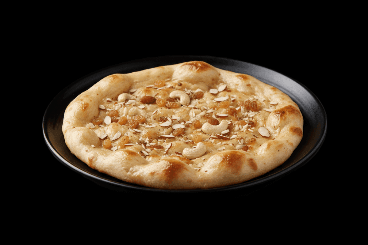 Peshwari Naan — Bread stuffed with almonds and baked in a clay oven, GB Canteen Kensal Rise