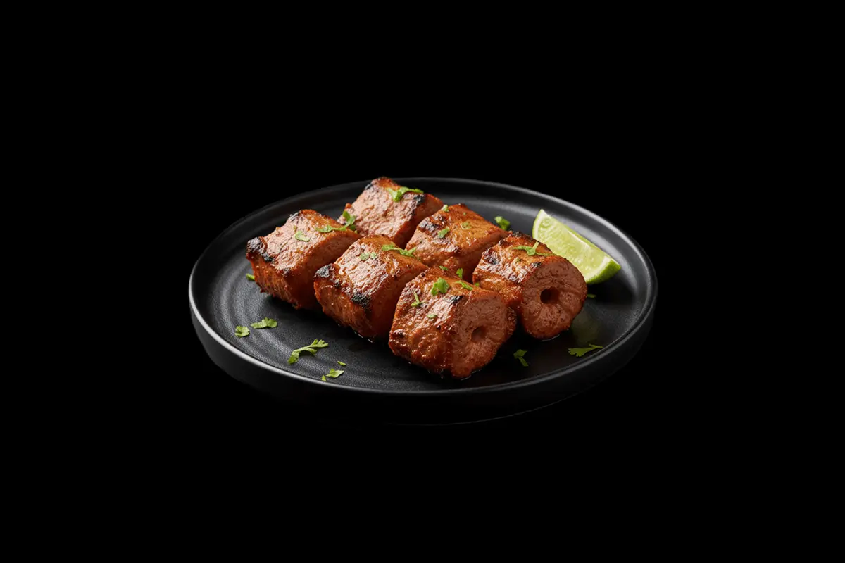 Lamb tikka main — Boneless chicken or lamb pieces marinated with mild spices and grilled in the tandoor, GB Canteen Woodford 