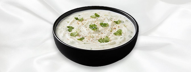 Cucumber Raita — Finely chopped cucumber mixed with yoghurt, roasted cumin, and black salt, GB Canteen Maidenhead