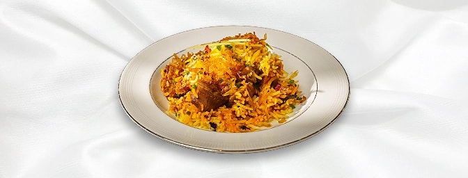 Lamb Biryani — Biryani - a dish with spiced rice and mixed pieces of either lamb, chicken, prawn or Vegetable Served with Veg