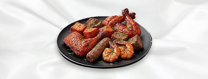 Tandoori Mixed Grill — Chicken and lamb tikkas, a quarter chicken, and a shish kebab, served with naan bread, GB Canteen Liss