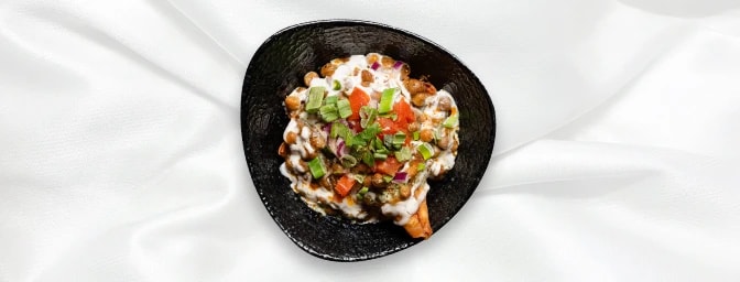 Punjabi Samosa Chaat — Smashed samosa topped with chickpeas, chutney, yoghurt, onions and spice, GB Canteen Beaconsfield