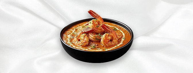 Dhansak - Prawn — Cooked with dall, fenugreek leaves and lemon to make a savoury, sweet & sour, hottish dish. Served with ric