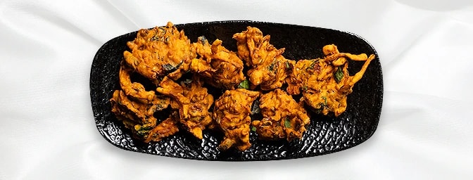 Palok Panir Pakora — Crispy round balls made with spinach, onions, and cheese. Served with salad, GB Canteen Wellington