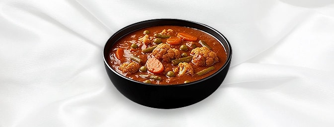 Balti Vegetable — Vegetable Balti are cooked in cast iron Kashmiri pan with special spices, fresh tomatoes, coriander & herbs