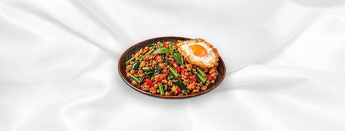 Chicken Basil — Stir-fry minced chicken with chili, fine beans, Thai basil leaves & lime leaves. Add a fried egg + 1.00, GB C