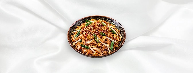 Kway Teow Goreng — Popular Indonesian wok-fried flat rice noodles with egg, soy sauce, beansprouts, onion and spring onions, 