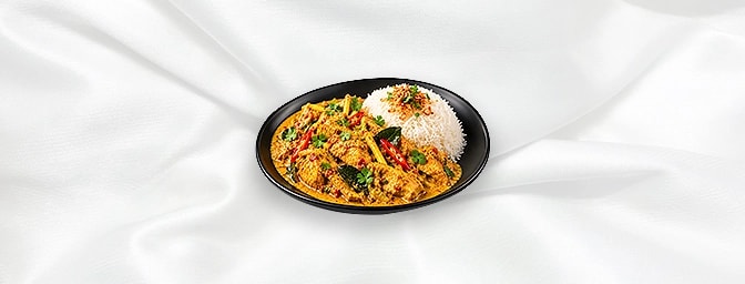 Malaysian Chicken Curry — Slices chicken in yellow curry with chili, turmeric, lemongrass, galangal, shrimp paste, ground spi