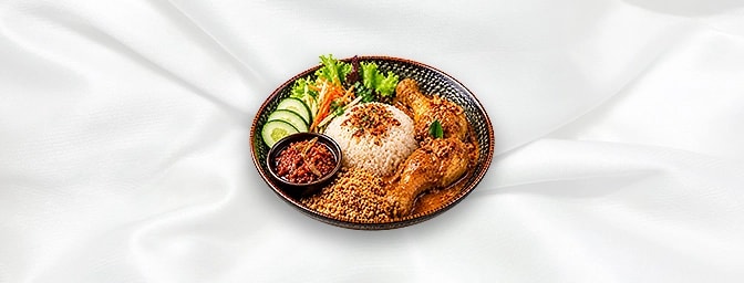 Nasi Uduk — Indonesian rice cooked in coconut milk, served with sambal Teri , chicken drumsticks curry and fried ground peanu