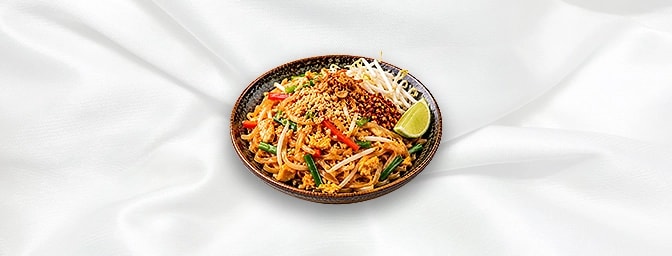 Pad Thai — Fried noodles with egg, mixed pepper, sweet turnip and beansprouts. Topped with crushed peanuts, shallot, chili fl