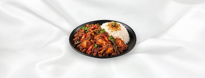 Rendang Chicken — Slow cooked chicken with aromatic spices such as roasted coconut, bay leaves, galangal, chili, onions, ging