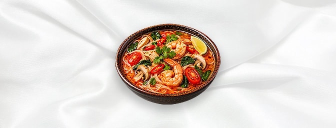 Tom Yum Soup Noodle — Vermicelli in spicy and sour soup and wok with king prawns or chicken, baby spinach, mushroom, tomatoes