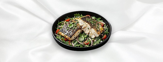 Sea Bas — Lightly seasoned Whole Sea bass, marinated in a selection of fresh herbs and spices then baked in the clay oven - s