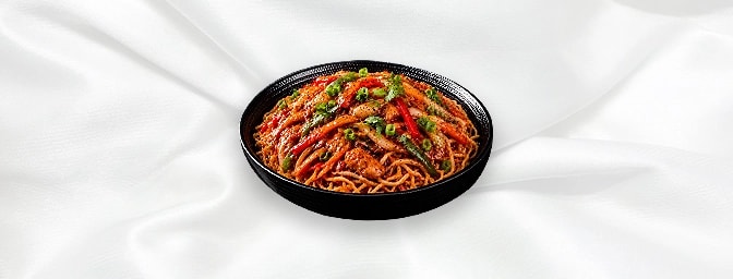 Fee Mein Noodle — Shredded veg or chicken cooked in chilli, garlic, soya sauce and coriander on the bed of wok fried noodle, 