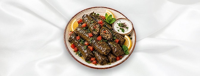 Warak Inab — Vine leaves lled with parsley, mint, tomatoes, onions & rice, GB Canteen Lebanese Barnes