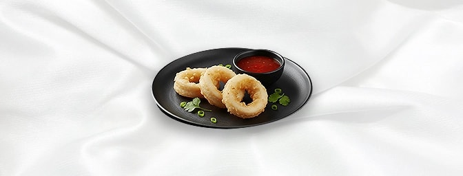 Calamari — Young and tendered squid, tempura fried tossed with fresh slice green chillies, GB Canteen Harrow