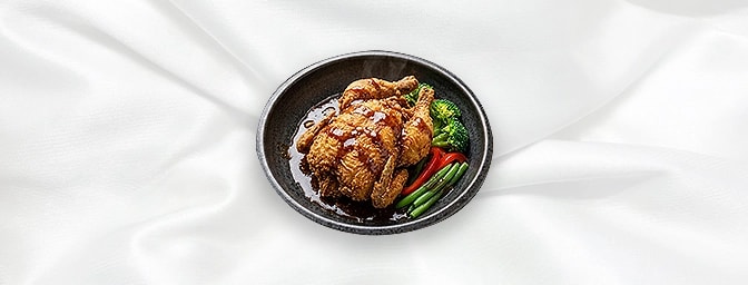 Baby Chicken — Whole fried Baby Chicken with a Chef's special sauce and a selection of steamed vegetables, GB Canteen Newingt