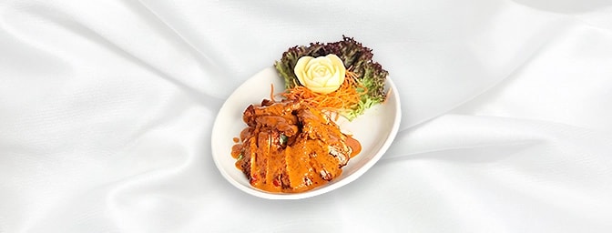 Chicken with Coconut Sauce — Golden Chicken breast fried in a batter and served with chilli, Coconut cream and fresh Thai her