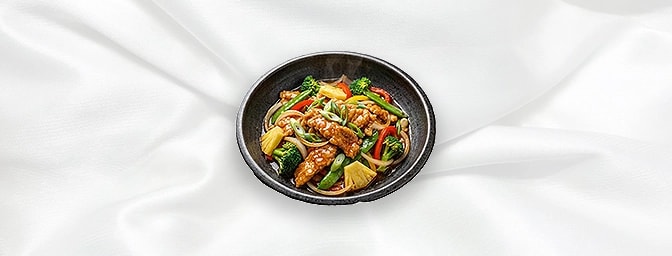 Sweet & Sour Chicken — Slightly batter coated Chicken stir-fried with fresh vegetables and Slices of pineapple in a sweet & s