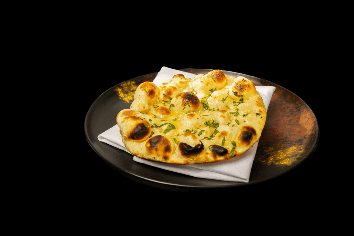 Tandoori Roti — Whole wheat flatbread cooked in a tandoor, providing a slightly firmer texture compared to naan, GB Canteen B